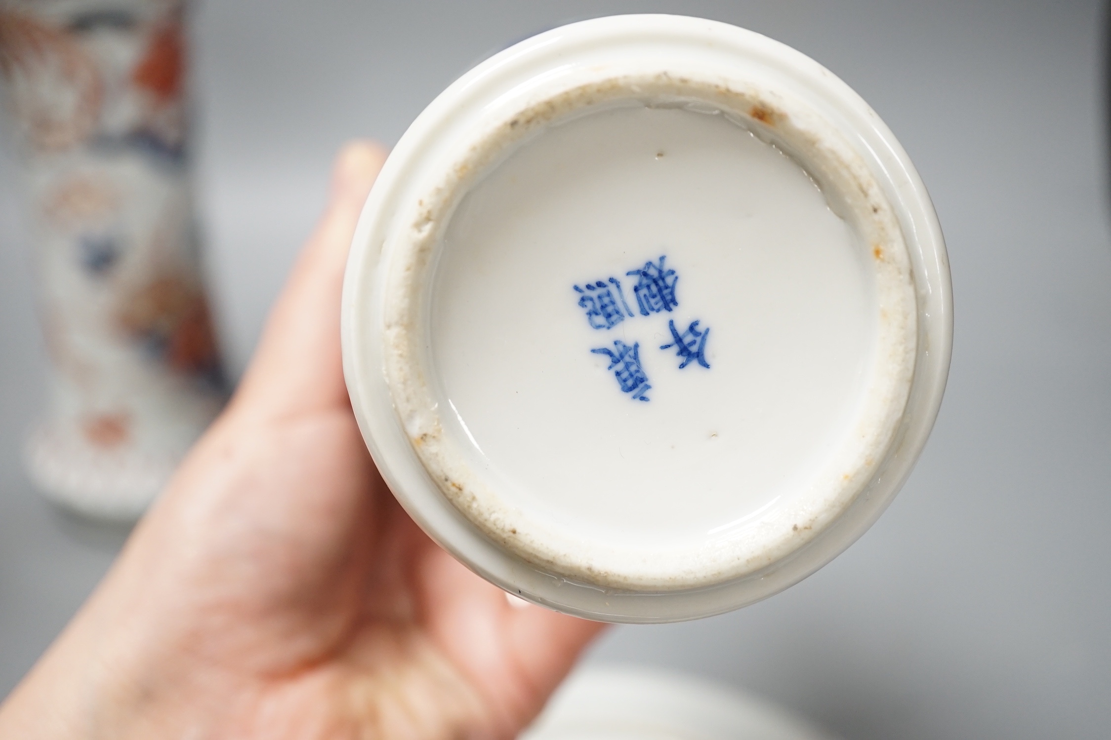 A Japanese Edo period Imari vase, 22. 5 cm, two 19th-century Chinese blue and white baluster vases, an Annamese blue and white box and cover, a Chinese famille rose plates and a blue and white dish
